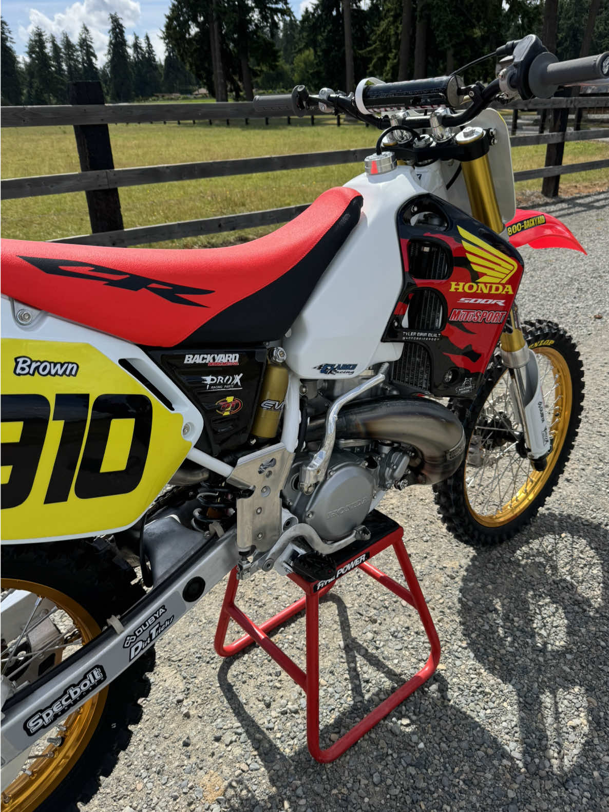 A post by @carsonbrown_910 on TikTok caption: What was your favorite year of Honda’s CR500? Tyler Bair has been building his personal 1997 CR500. He just got his bike finished up and asked if I wanted to ride this pristine machine. Can’t pass that up 🤠 Here is a list of people that personally helped Tyler out on his CR500 project 🔥 @PhatheadRacing, Nicks Vapor Honing Services, Dunlop Tires, Spec Bolt, Dirt Bike Magazine, BBR Motorsports, @MotoSport.com, @All Balls Racing, Dirt Tricks, DG2 Motorsportz, Clarke Manufacturing, EVO Suspension, @backyarddesign, Pro-X Racing,  DT1 filters, Rylie Miller, Dan Moore. The riding video is up next. Tyler is open to offers on this thing, so DM him on insta (hondarider007) if you are interested.  @Red Bull Motorsports @Red Bull #CR500 #honda #2stroke 