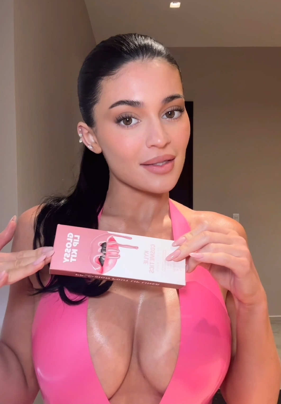 A post by @kyliejenner on TikTok caption: glossy lip kits coming 6.24 @Kylie Cosmetics 