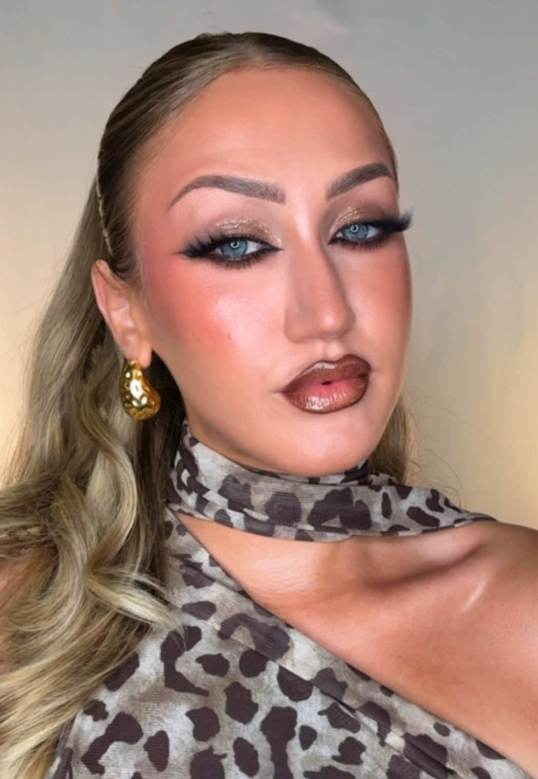 A post by @katiefarhood on TikTok caption: Replying to @Hailey💖 grrr 🦁🐈‍⬛ #transitiontutorial #makeuptransition #makeuptransformation #MakeUpArtist #cateyemakeup 