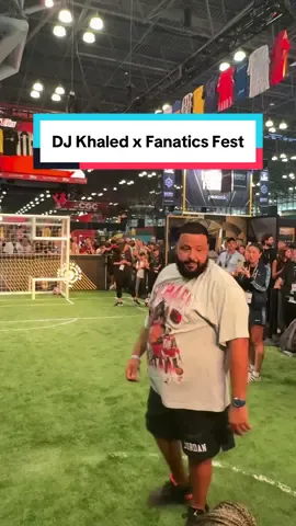 A post by @mls on TikTok caption: DJ Khaled shooting challenge at @Fanatics Fest ⚽️ #djkhaled #fanaticsfest #Soccer #MLS 