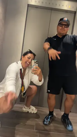 A post by @ on TikTok caption: Dancing in elevators is our new thing! Elevate your mood, one floor at a time. Don’t take life too serious… move your body, laugh a little, and level up.✨ @JoelWood 