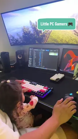 A post by @ourlittlemms on TikTok caption: Just a Papa teaching his little ones how to be PC gamers from a young age 🥰❤️ #cute #adorable #sweet #family #kids #papa #Gaming #pcgaming #sonsoftheforest #fyp #foryou #wholesome #cutebaby 