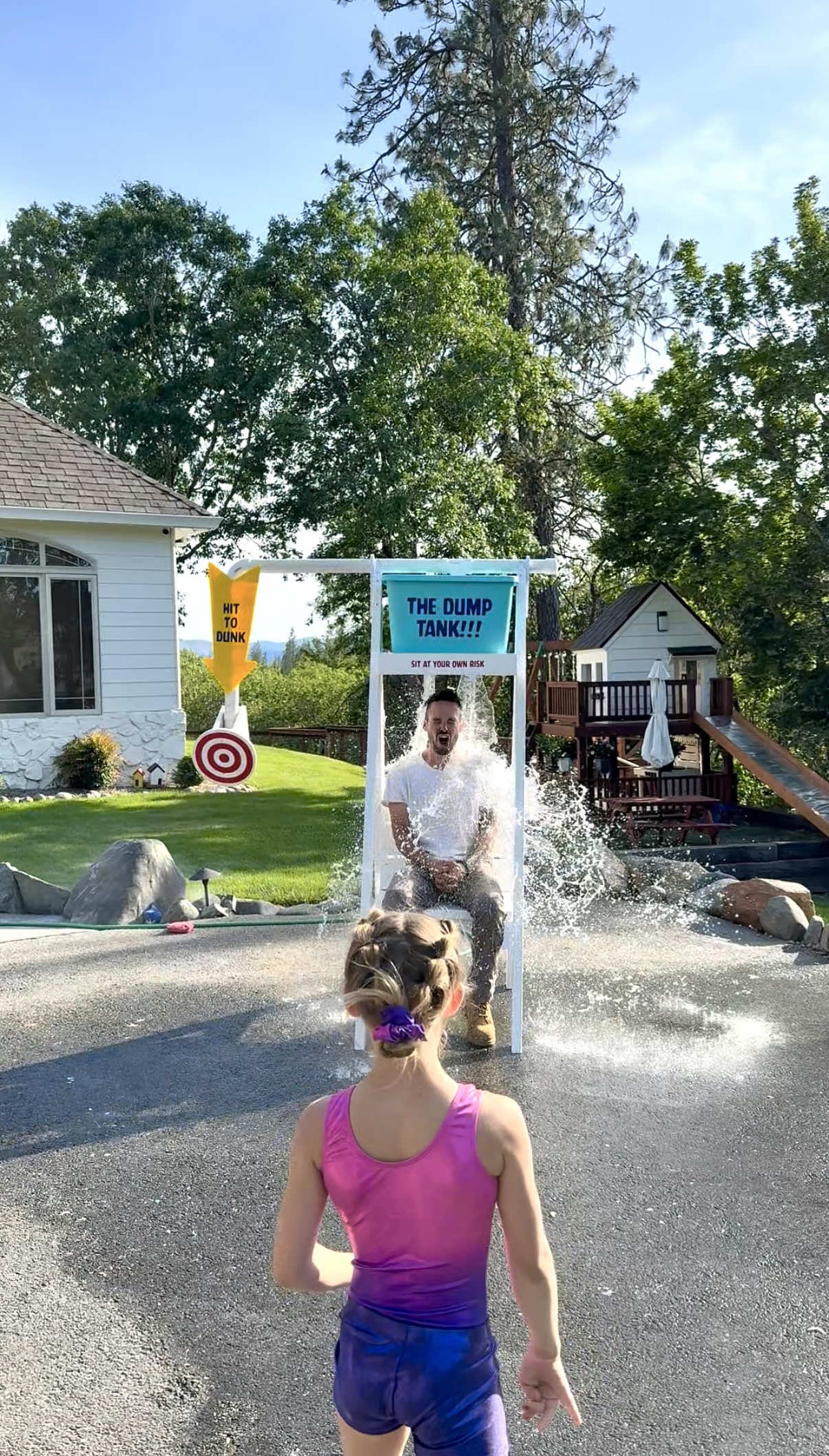 A post by @dadsocial on TikTok caption: These are the coolest teachers ever! I was initially going to take a full blown dunk tank, but they asked if it could be a little less submersive… So we ended up with this “Dump Tank” that automatically refills after after water drop. If you want to ever build one of these tanks, I just followed plans I bought from @wilker_dos!! Check out her page, she’s awesome! But I have to admit, it was a bit more difficult than expected… She makes everything look so simple! With that said… I hope everyone enjoyed the video and has the best summer!! #diy #dunktank #dumptank #school 