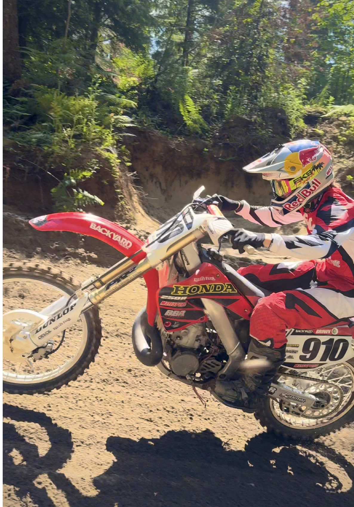 A post by @carsonbrown_910 on TikTok caption: On a scale of 1-10 what do you guys rate the dirt at Community Motocross? 2001 CR250 was digging 😈 @Red Bull Motorsports @Red Bull @MotoSport.com @All Balls Racing #CR250 #CR250R #honda #2stroke 