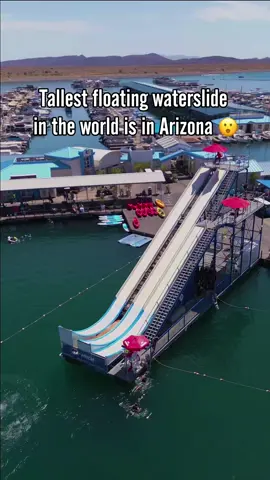 A post by @welcometoarizona on TikTok caption: Would you ride this floating water slide? 🌊😎 H2whoa is located at Lake Pleasant, AZ, and it is now open for the 2025 summer season! Tag a friend! 👇 #welcometoarizona #arizona #waterslide #travel #viral 
