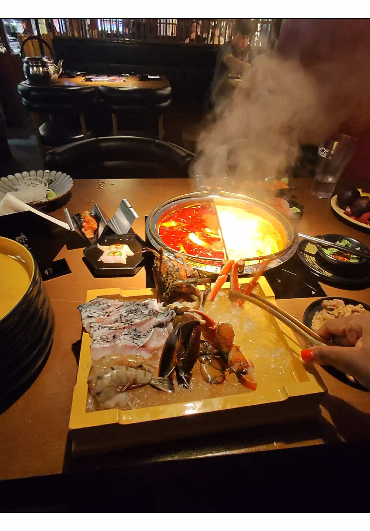 A post by @aiyannace on TikTok caption: Cooking my hotpot 🙂‍↕️ 🥩 #hotpot #waygu #sushi #mangosteen 