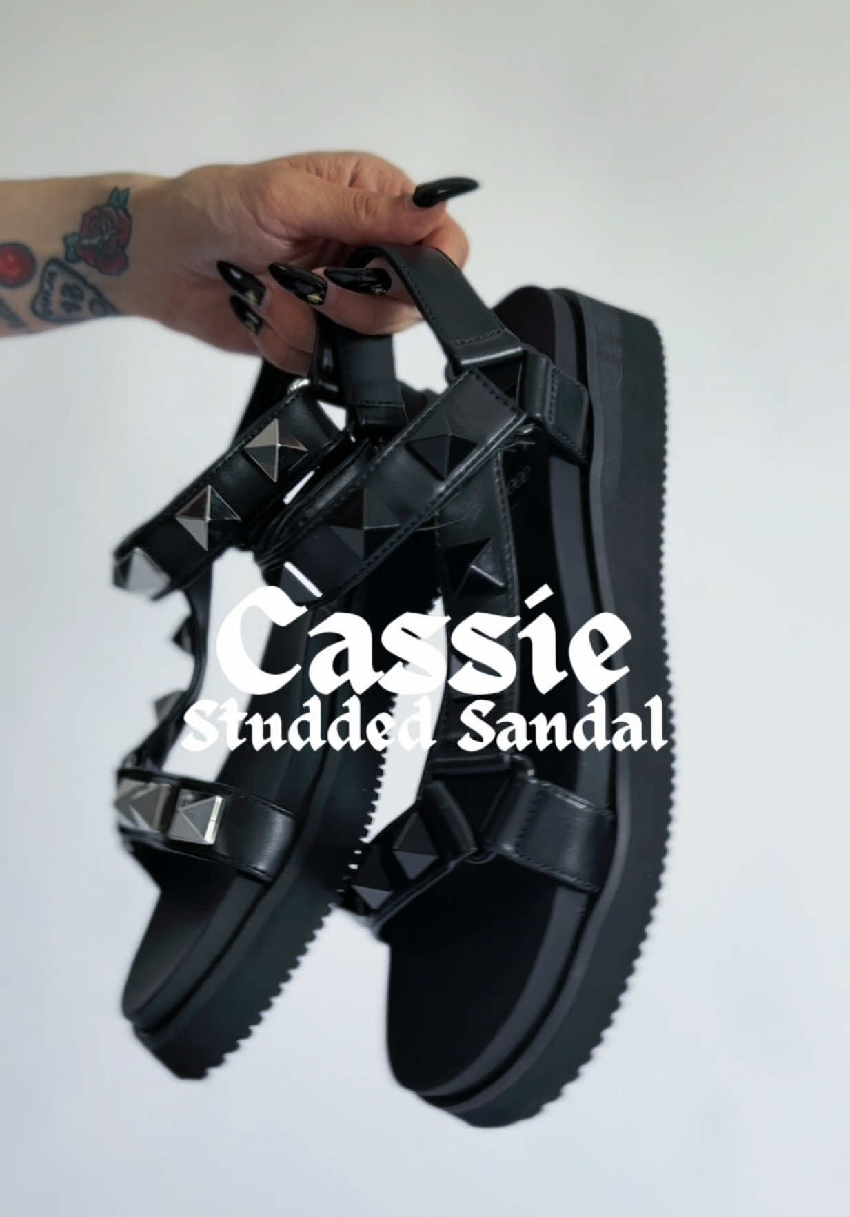 A post by @foxbloodshop on TikTok caption: NEW! Goth Sandals just in time for summer 🔥 Both colors linked above! #gothtok #gothfashion #gothgirl #altgirl #altfashion #studded #spikes #puckrock #summergoth #gothicstyle 