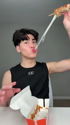 A post by @lourdasprec on TikTok caption: TRYING KOREAN CORN DOGS FOR THE FIRST TIME 🌽🌭 #koreancorndog #cheesepull #corndog #hotcheetos #twohandscorndog #foodreview #mukbang #koreanfood 