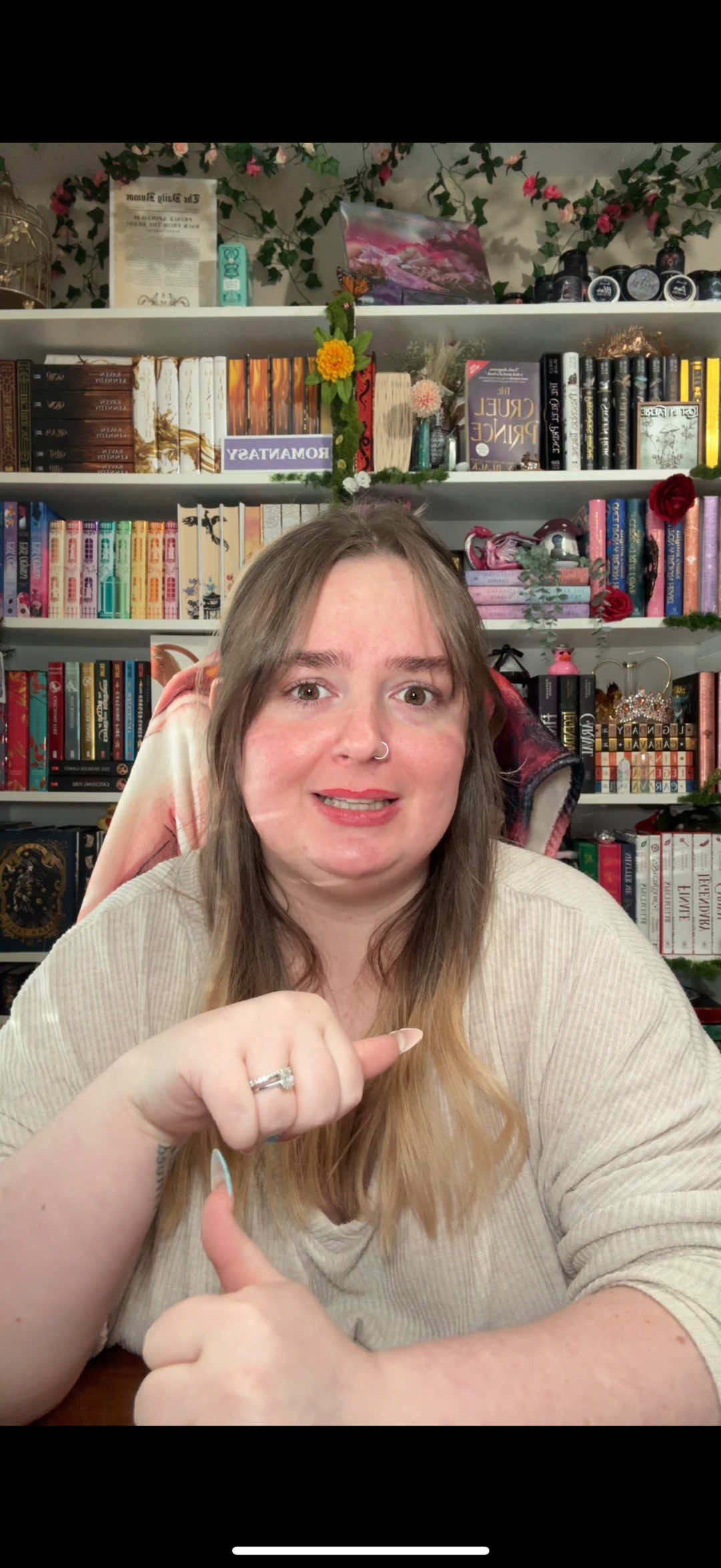 A post by @fictional.deanna on TikTok caption: the new episode of love island pmo i may have to go rewatch k-pop demon hunters for a third time lmaoo #kpopdemonhunters #netflixmovies #nookishthoughts #booktokers #booktoker #bookishhumor #bookishfyp 