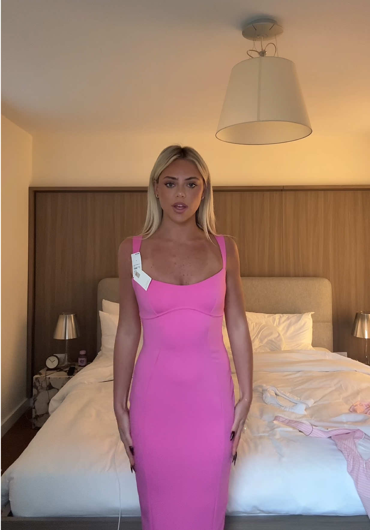 A post by @livvwalker on TikTok caption: trying on fits @Revolve #revolvepartner 