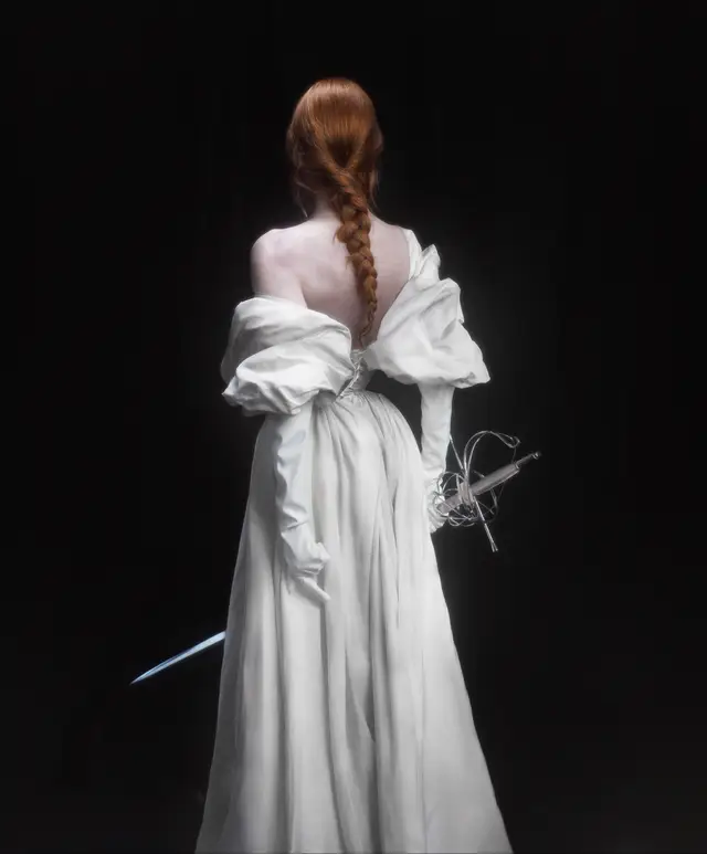 A post by @emackelder on TikTok caption: A photographic recreation of @douni_hou artwork🤍 “It is not the beginning of the end. It is the end of the beginning.” -Winston Churchill Photographer: Elizabeth Elder  Video/gaffer: @Griff  Model: @esodette  MUA & Hair: @mag!!!  Gown: @Officeseven  Lights: @amarancreators  #dounihou #portrait #ethereal #fineart #photography 