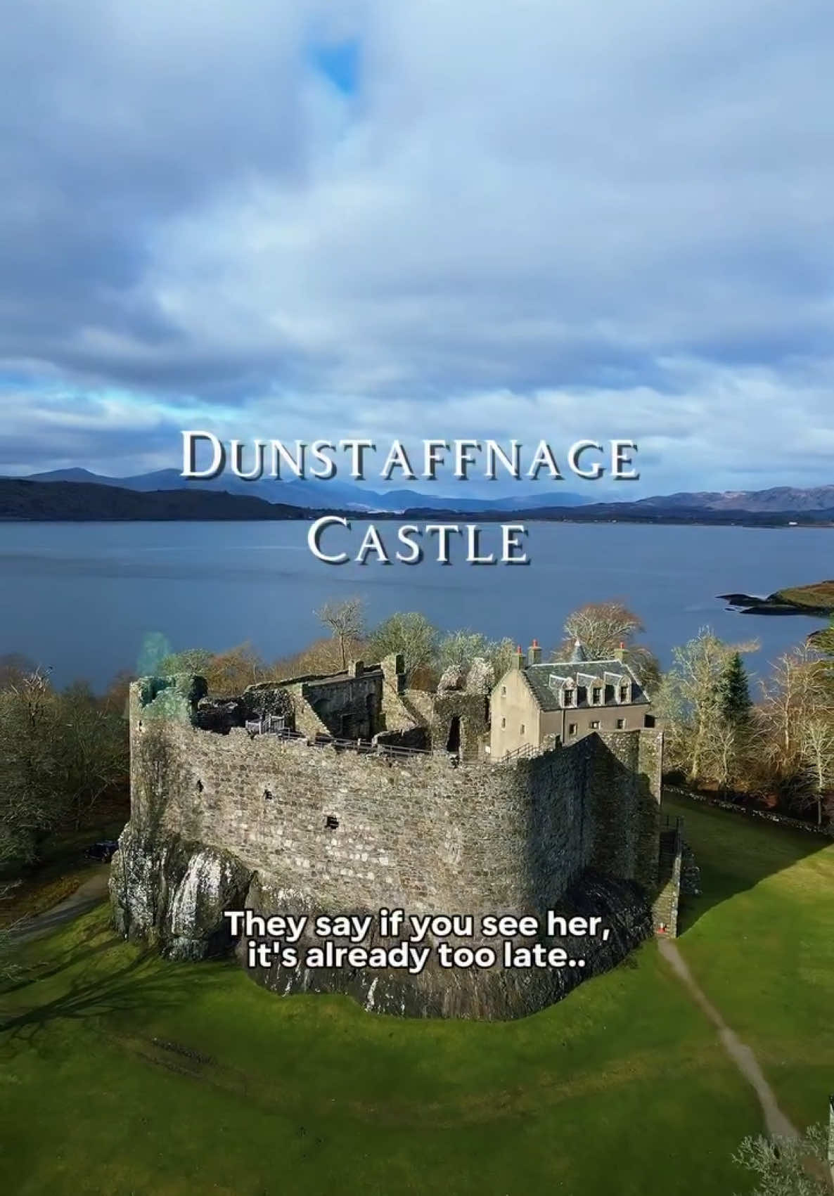 A post by @andy_highlander on TikTok caption: The castle’s ghost, the “Ell-maid of Dunstaffnage,” is said to wander the ramparts dressed in green.  Her appearance is tied to key events in the lives of the Campbell family, the hereditary keepers of the castle.  If she smiles, good fortune is near. If she weeps, trouble is coming… #scotland #ghoststory #dunstaffnagecastle #oban #history #andythehighlander 