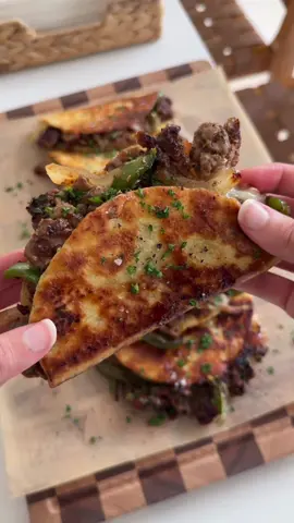 A post by @moribyan on TikTok caption: Philly Cheesesteak Tacos! Full recipe up on the blog as always - link in bio 🤎