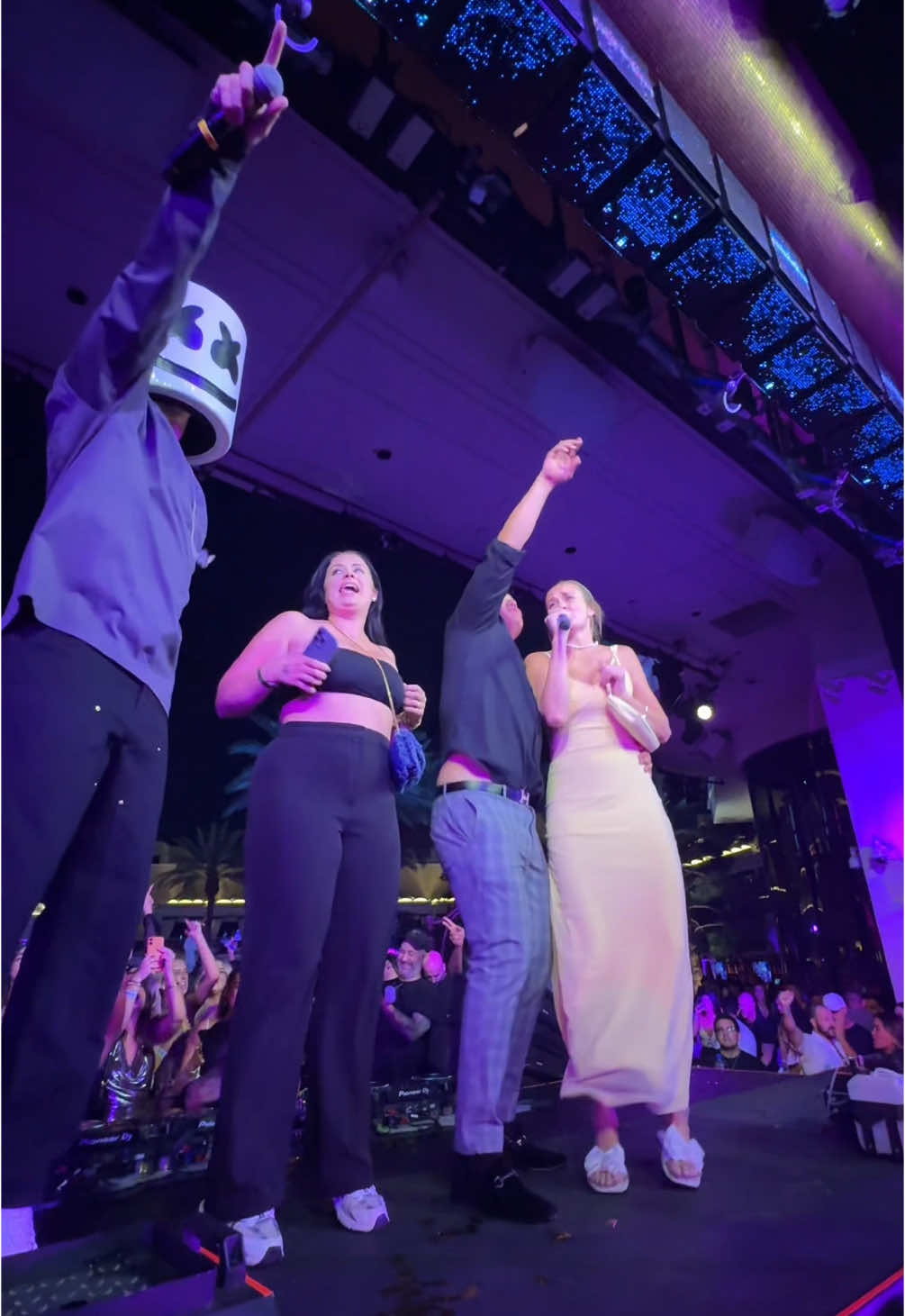 A post by @marshmello on TikTok caption: If I pass you the mic what are you singing?