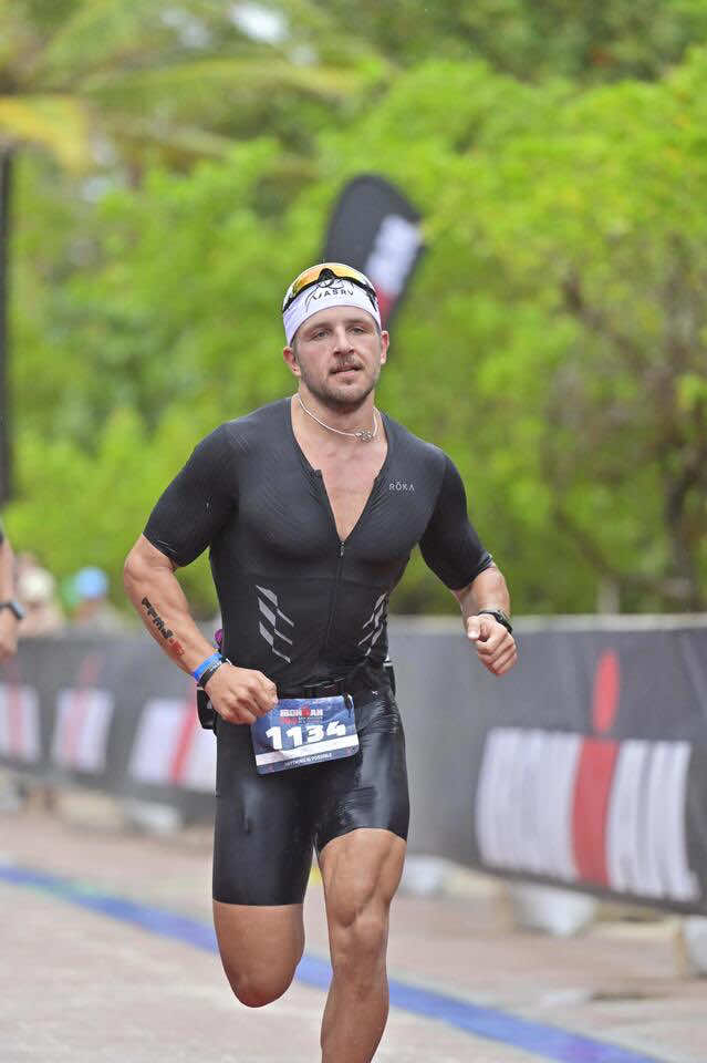 A post by @samsacfit on TikTok caption: Not every race goes to plan — but the mindset never changes. Swim got canceled, wind was wild, run was humid and hard. But I didn’t train for perfect conditions — I trained to adapt and finish strong. #ironman 
