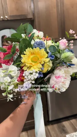 A post by @madisonlynge on TikTok caption: most of my faux florals & supplies are from @Hobby Lobby !!! i really love how it turned out & the chiffon ribbon really ties it all together☺️🩷💐 #2025bride #bridalbouquet #weddingdetails #fakeweddingflowers #fakeflorals #weddingflowers #hobbylobby #diybride #flowers #bouquet #fauxbridalbouquet #flowebouquet #fyp #weddingplanning 