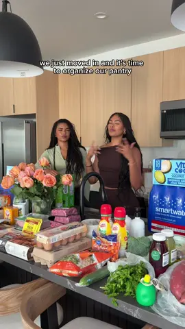 A post by @makenzieandmalia on TikTok caption: Let’s organize our fridge, pantry, and wine cooler for the first time in our new townhouse🤭✨ #organizing #fridgeorganization #groceryhaul @CelsiusOfficial @Vita Coco @BODYARMOR @poppi shop 