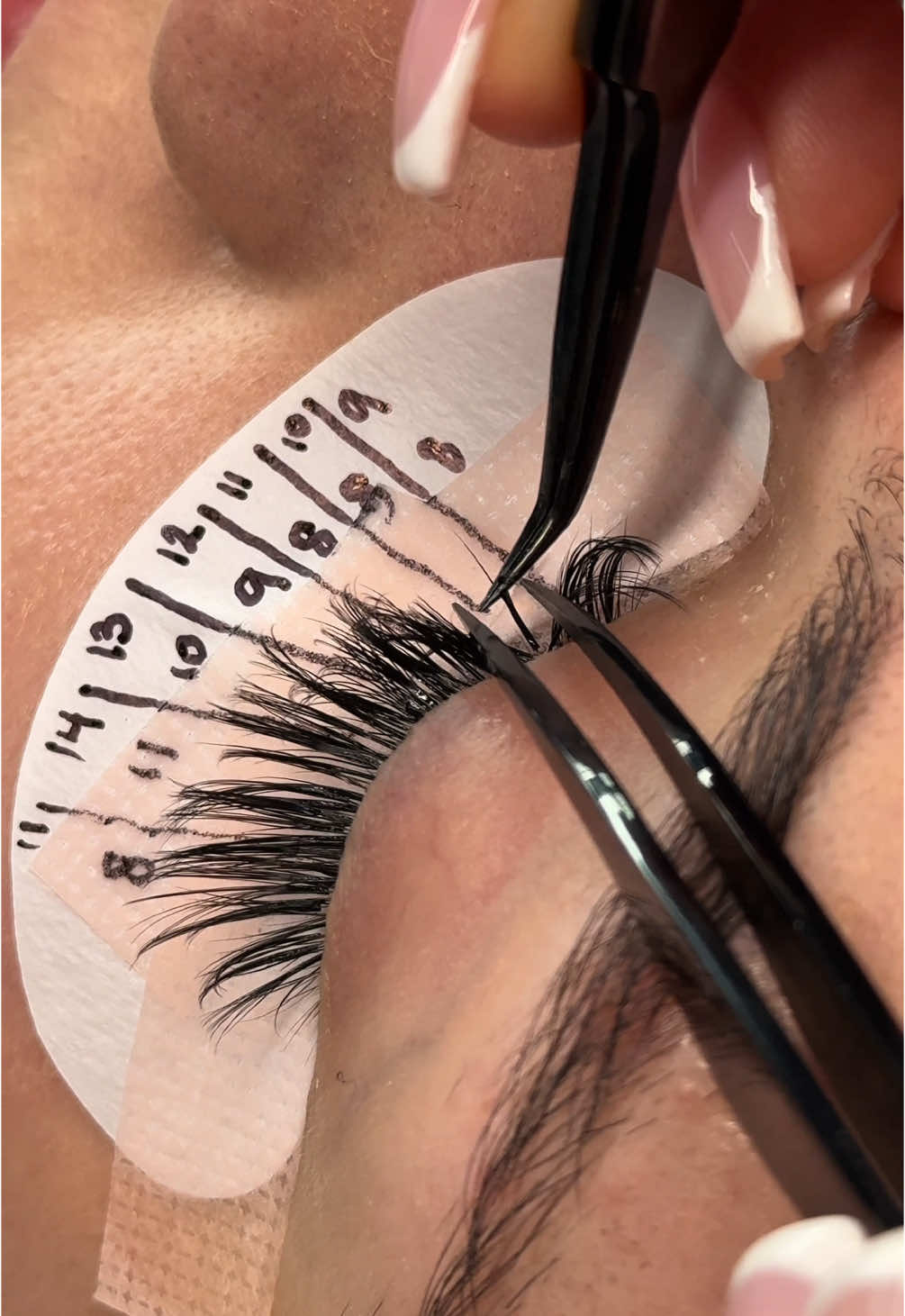 A post by @mauvellalashacademy on TikTok caption: Kitten eye set for a client who wanted a cat eye look but didn’t want a droopy eye ❤️‍🔥 #wispylashes #trendinglashes #promadefans #premadefans 