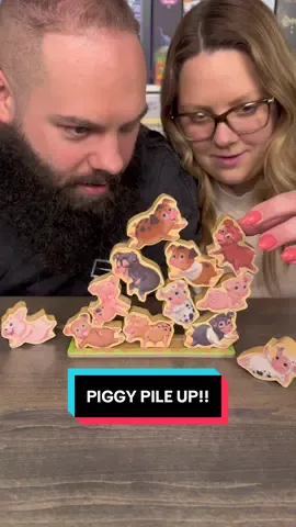 A post by @games4two on TikTok caption: Come Play Piggy Pile Up With Us!! #boardgames #gamenight #couple #fun 