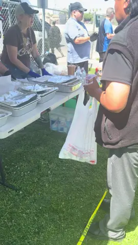 A post by @beauty2thestreetz on TikTok caption: I see the criticism from my lives. It is not ego when I correct the volunteers. Everything is portion control if not, half of that line won’t eat. I prepared the food. I know how much should be scooped how many pieces of meat per bread… these things are important. I have to ensure that as many people eat as possible.