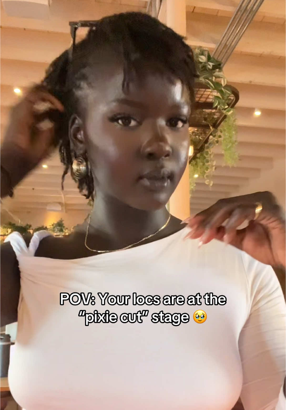 A post by @missslado on TikTok caption: I love them!!! #microlocs #locs  #locjourney 