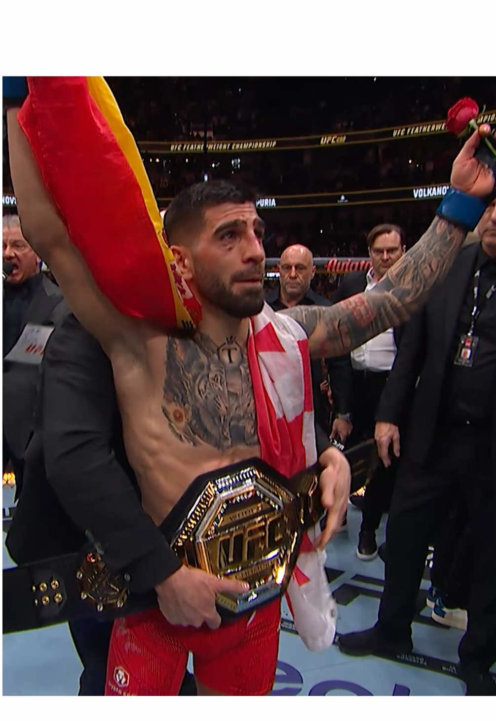 A post by @ufceurasia on TikTok caption: 🌹🏆 Вспоминаем как Илия Топурия стал чемпионом UFC в полулегком весе! #UFC #champions #MMA #martialarts #combatsports #fight #viral #brutal #ko #highlights #UFC317 