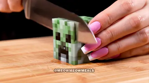 A post by @meowmeowmeals on TikTok caption: Cutting Minecraft Blocks ASMR 2 #asmr #aiasmr #asmrsounds #asmrai #satisfying #relaxing #oddlysatisfying #minecraft #minecraftasmr #veo3