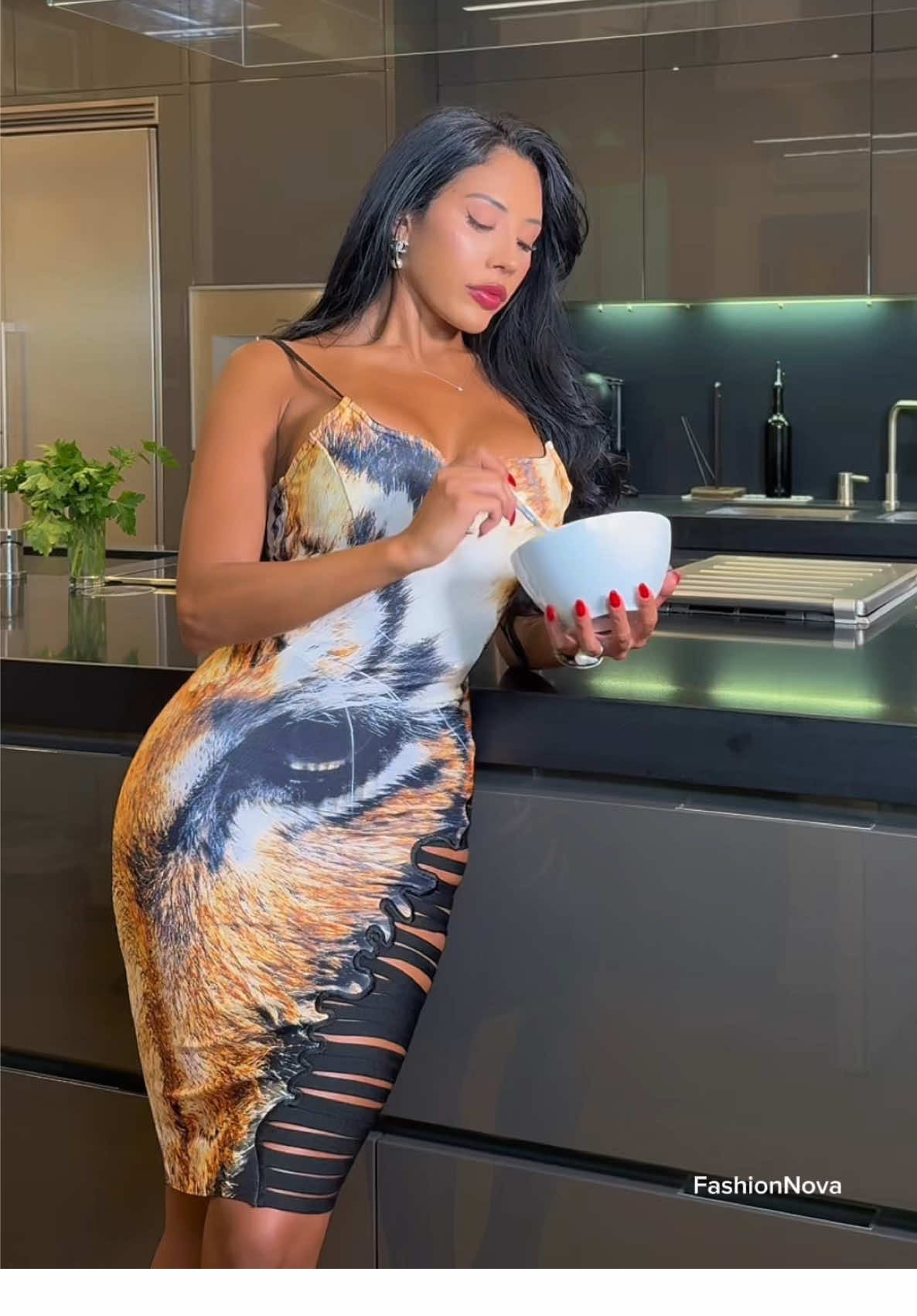 A post by @natalieyospina on TikTok caption: Pappa Al Pomodoro @Fashion Nova  👗Gia Lace Mesh Maxi Dress - Black 👗Tiger Eyes Bandage Midi Dress - Black/combo . . . . #pappaalpomodoro #italianrecipes#ricettesane #natalyospina #blackdress #chef 