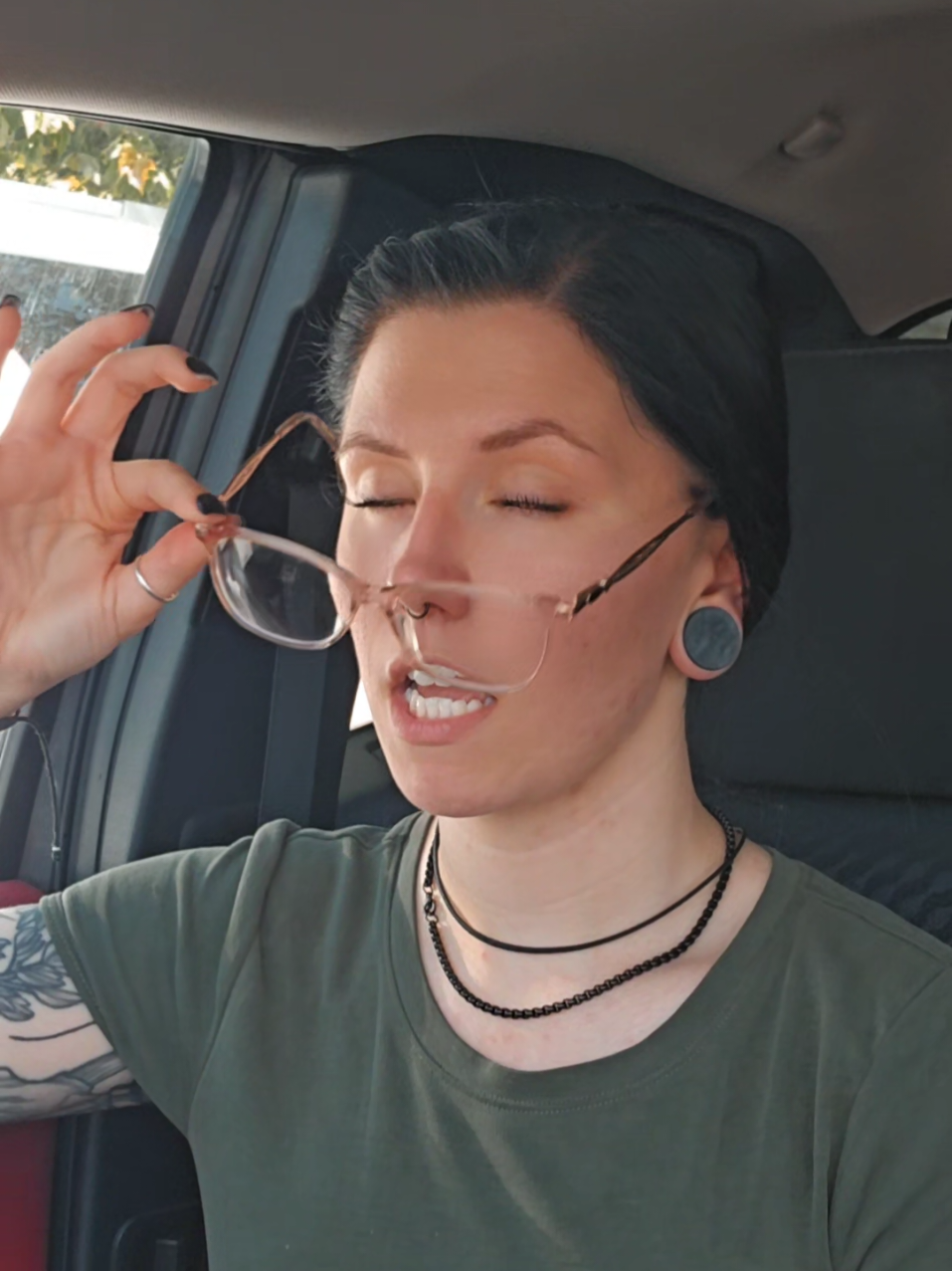 A post by @tingles34 on TikTok caption: Good ever green forest 🥴 #fyp #banana #foryou #gwenstefani  #glasses #viral #tingles #alt #xybca #tatted #inked #gauges #blackhair 
