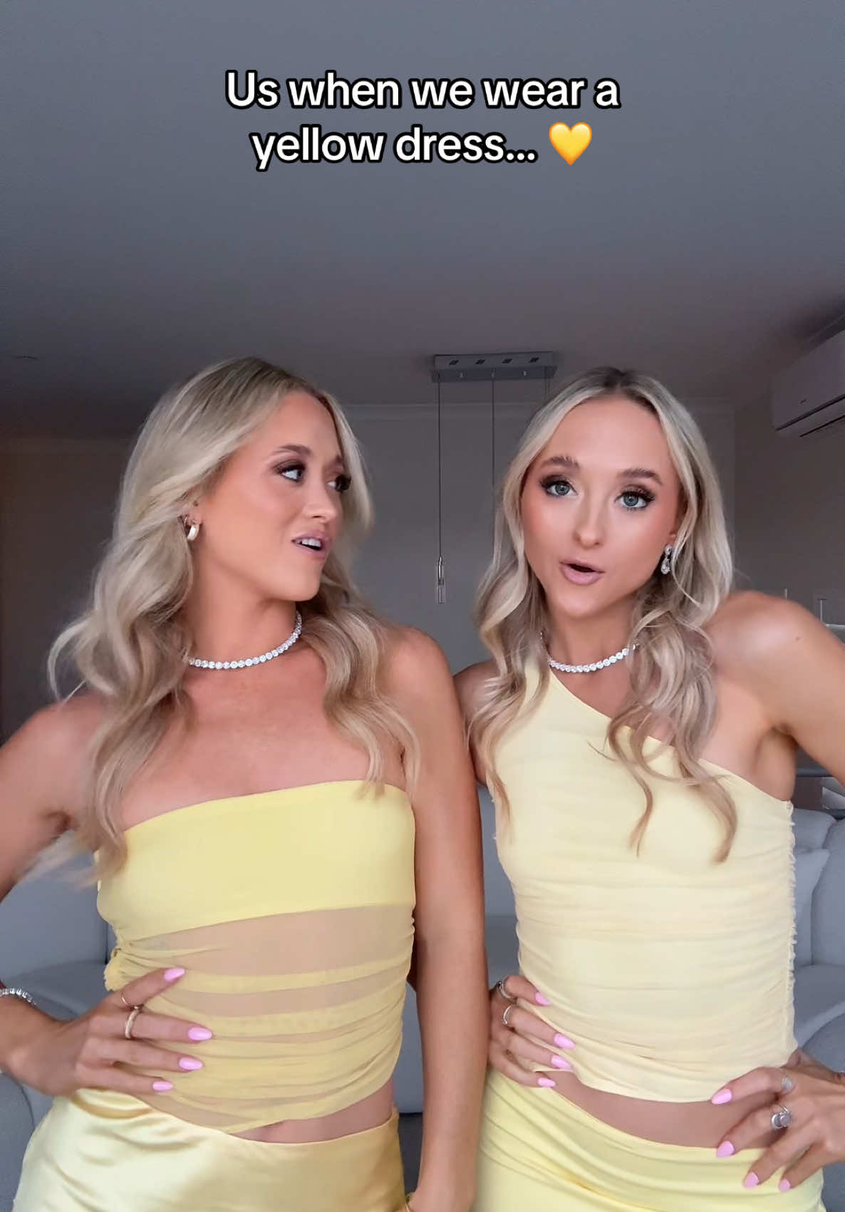 A post by @rybkatwinsofficial on TikTok caption: Everytime 😜💛 #yellowdress #twins #howtoloseaguyin10days 