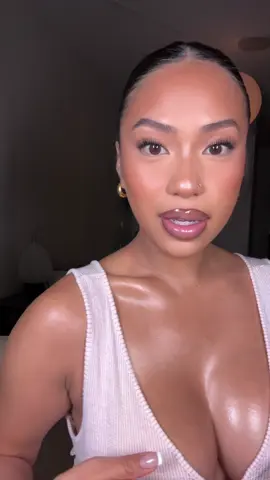 A post by @imabbysigua on TikTok caption: The glowiest body ✨ I will ALWAYS have my body glow on #glowyskin #bodyoil #skintok product: fenty body lava 
