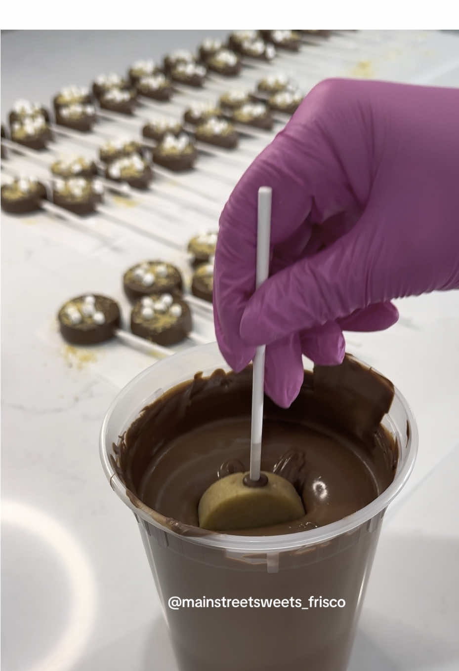 A post by @mainstreetsweets_frisco on TikTok caption: I have a feeling these are gonna be a crowd favorite 🤩 #cakepops #cakepopprep #cakepopdough #fyp #foryou 
