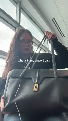 A post by @whor3chata_ on TikTok caption: what’s in my airport bag tour @CELINE 
