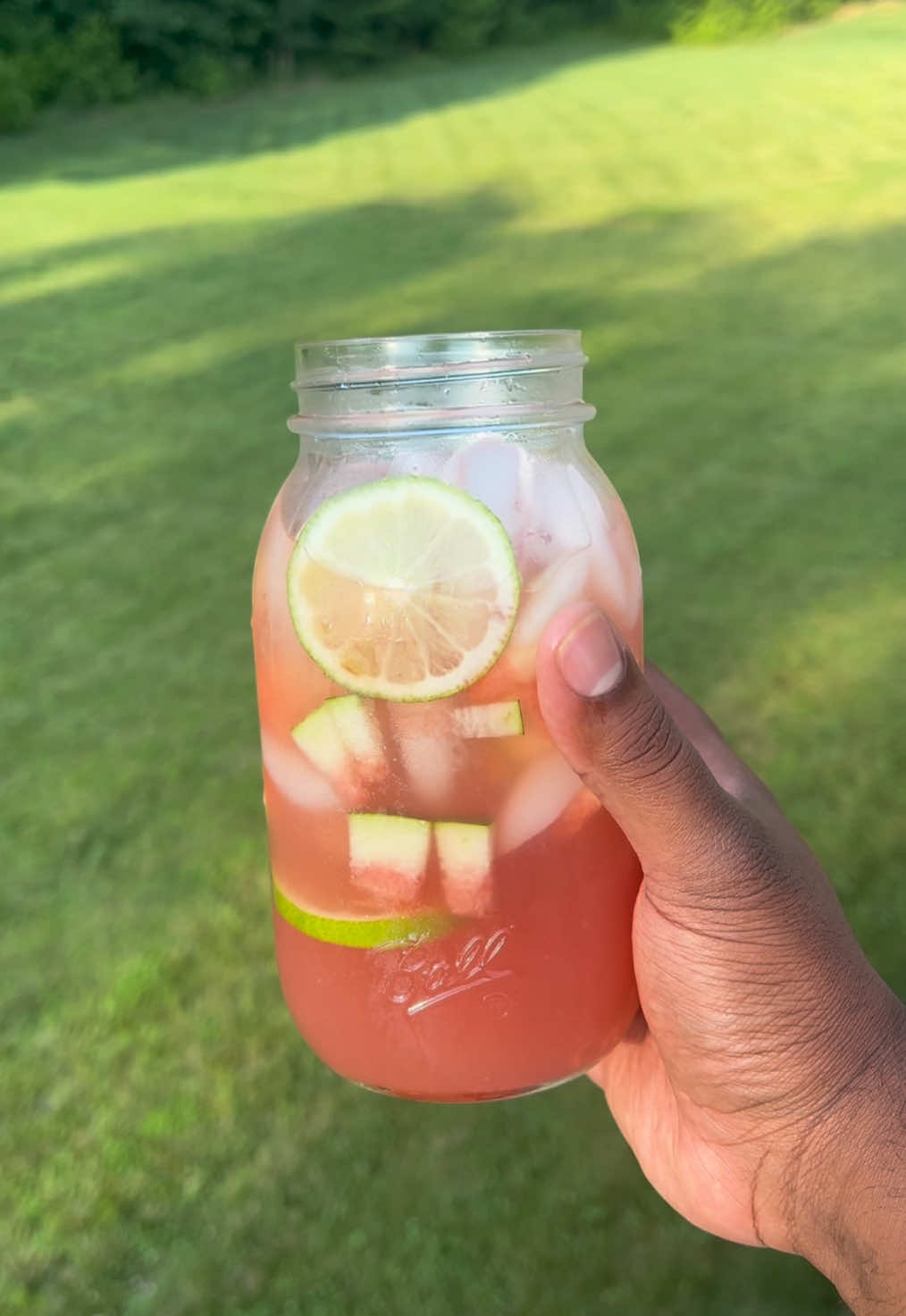A post by @eatwitzo on TikTok caption: Watermelon Lemonade!   It was about 100 degrees outside today & it’s safe to say it is HOT! Make a pitcher or two of this to help cool down, enjoy!  Full ingredient list:  4-5 lemons juiced  2 cups watermelon  2-3 cups water  1/2-1 cup sugar (equal parts water for the simple syrup)  #watermelon #lemonade #eatwitzo 