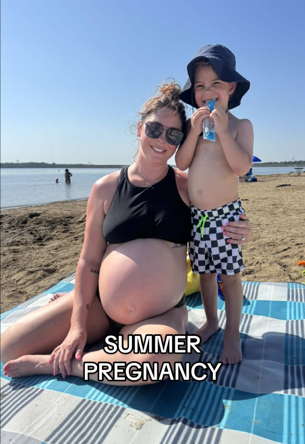 A post by @katiesantry on TikTok caption: Pregnant mamas- are you ok???  It’s a crisp 98° today 🫠🥵 #momtok #momlife #boymom #millenialmom #momsover30 #29weekspregnant #thirdtrimester #pregnancyhumor #pregnanttiktok #babybump #fyp  #pregnantlife #pregnancytok