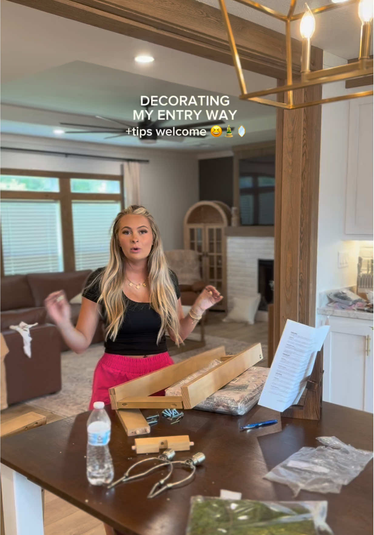 A post by @kylieapitts on TikTok caption: What are we thinking? Yes, no? Rug? A tall skinny plant on the other side? #ditl #momtent #decorating #entrywaydecor 