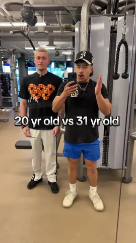 A post by @jorges_fades on TikTok caption: He’s 20, I’m 31… but age ain’t nothing but a number 😤💪 Had to cheer him on while he roasted me mid-set 😂 Still outlifting him tho 👴🏽➡️🦍  #GymBattle #MillennialVsGenZ #WorkoutComedy #FitnessJourney #OldManStrength #BarberStrong