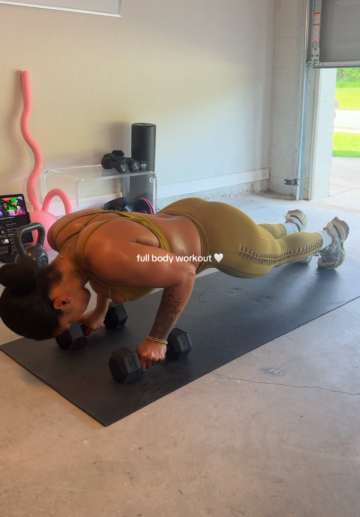 A post by @aaliyahgiselle1 on TikTok caption: #fyp #foryoupage #foryou #garageworkout #garagegym 