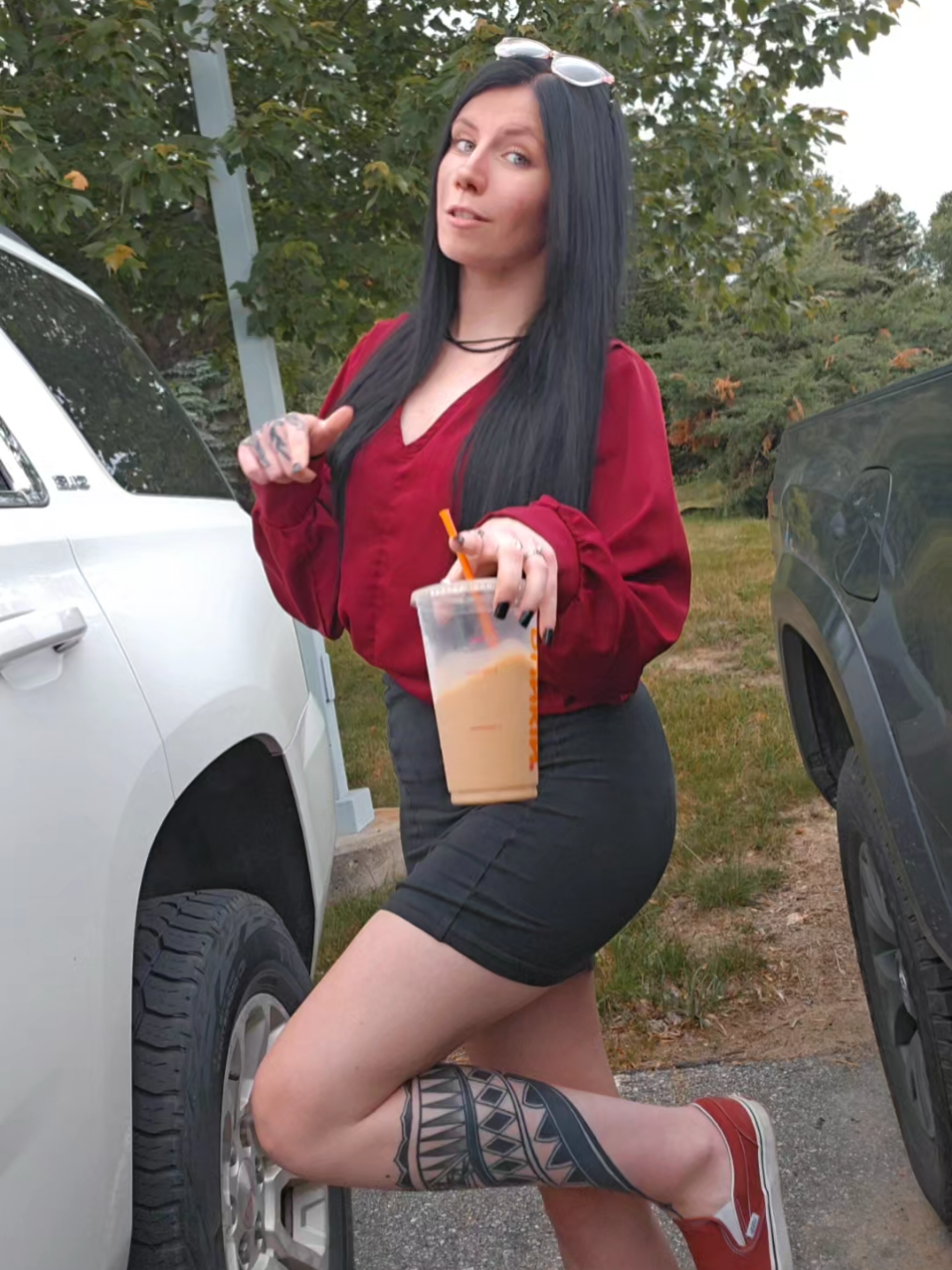 A post by @tingles34 on TikTok caption: Even asked for extra ice this morning & it still melted quickly 🫠  #fyp #icedcoffee #foryou #dunkin  #glasses #viral #tingles #alt #xybca #tatted #inked #gauges #blackhair 