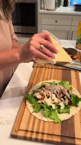 A post by @tylergrowthlife on TikTok caption: Chicken Caesar wraps on the back patio #vlog #DayInTheLife #outdoorcooking #blackstone #cookingvlog #backyardvibes #backpatio #chickencaesar #chickencaesarwrap 