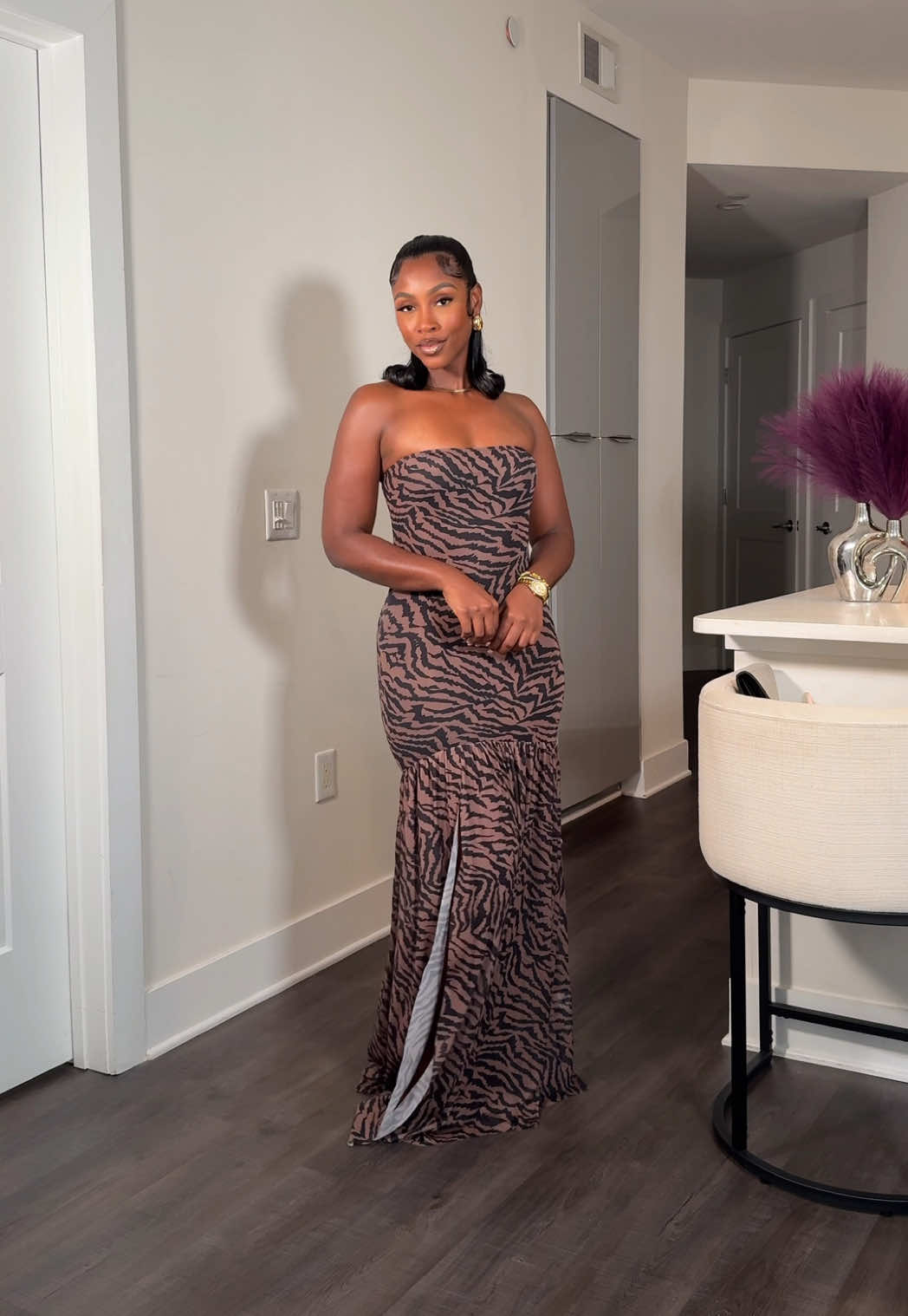 A post by @caittheegreat__ on TikTok caption: Serving mesh and a moment 😍✨ Whether you’re feeling bold in prints or sleek in stripes, this strapless high slit dress is giving drama in all the right ways. Date night? Vacation? Girls trip? Say less.  • In my Amazon Storefront, linked in bio 🥰