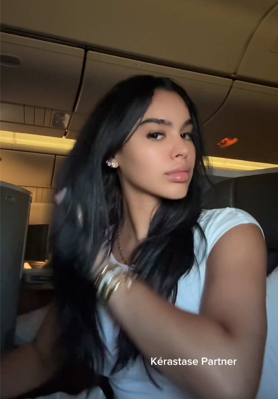A post by @amayaliacolon on TikTok caption: Gotta take care of my hair even with extensions in using my @Kérastase 8hr magic night serum ✨🤍 #KerastaseUSA #KerastasePartner