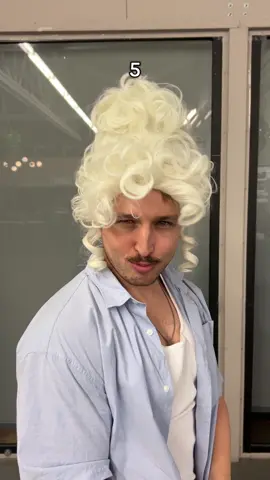 A post by @smosh on TikTok caption: who ate in this wig?
