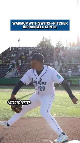 A post by @espnatbat on TikTok caption: Warming up with a switch-pitcher 🤯 (via MsPlayerDev/X) #baseball #pitcher #switch 