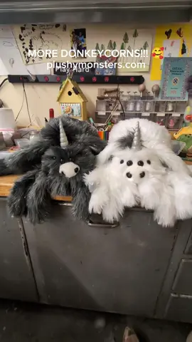 A post by @plushymonsters on TikTok caption: DONKEYCORNS!!! 🥰🥰🥰 These guys will be available as part of tomorrow's Hatching Day, Thursday June 26th, 2025, 5:00 p.m. MDT at plushymonsters.com! 😁 The Lil' Guys will be $220.00 plus shipping each, and the Middlin' (if I get it done 😬) will be $300.00 plus shipping. 😁 Sorry I don't sound more enthused in this video, my enthusiasm fled about forty-five minutes ago. 😆😭 Last night at our house was a rough one. Archie woke up puking in the wee hours so the night was a bit shorter than David and I might have wished. 😬 Mom and Dad also stayed at the shop pretty dang late tonight, trying to finish up a bunch of stuff that we arbitrarily decided needed to be done. 🤦 Because we're cool like that. 😬😆 Anywho! I hope you love these adorable precious babies, and I will post a run through of the rest tomorrow! 😁 #plushymonsters #hatchingday #spidersindisguise 