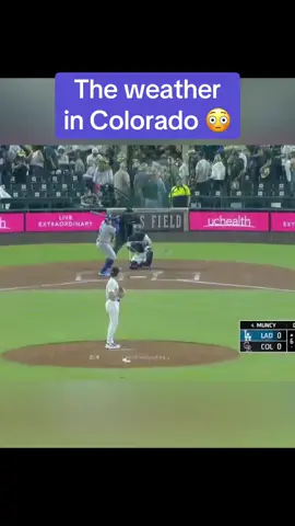A post by @espnatbat on TikTok caption: It’s #raining hard 😮 (via @MLB, SportsNet LA) #mlb #baseball #rain 