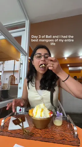A post by @tanupaslife on TikTok caption: I now understand why my Indian parents are obsessed with buying mangoes every time at the grocery store even though half the time they taste horrific, because in South Asia and Southeast Asia the mangoes are on another dimension of good  #bali #balivacation #ubud #itinterary #mango #tropicalfruit 