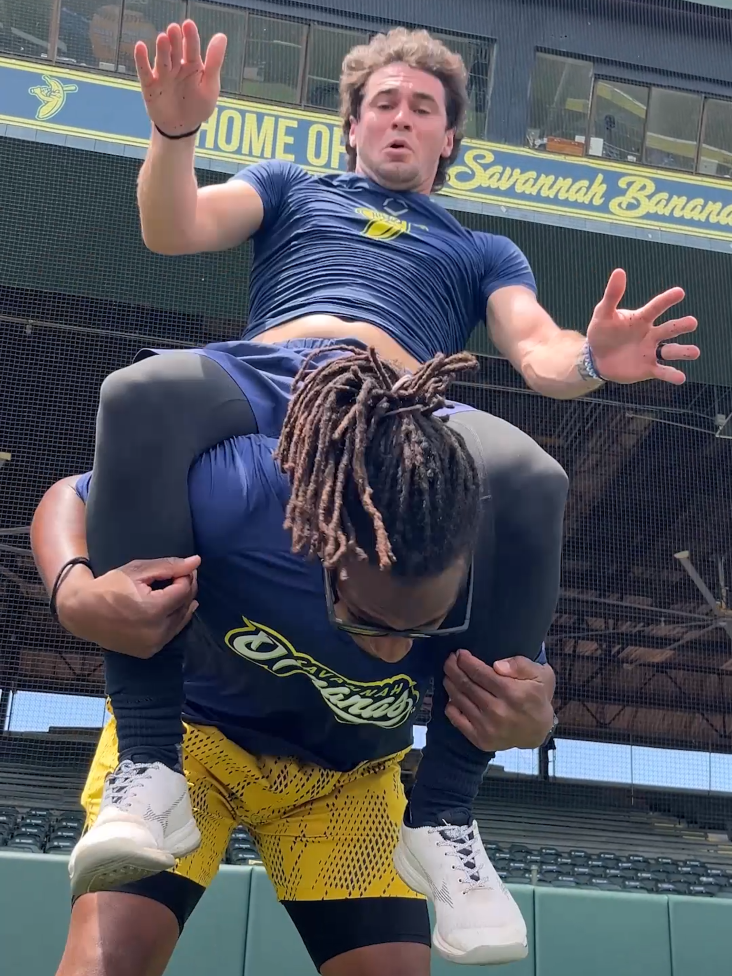 A post by @thesavbananas on TikTok caption: the crowd just thinking they were filming a fit check😭 @david.meadows @cprime.11 #savannahbananas #bananaball #fitcheck #ootd #baseball #wwe
