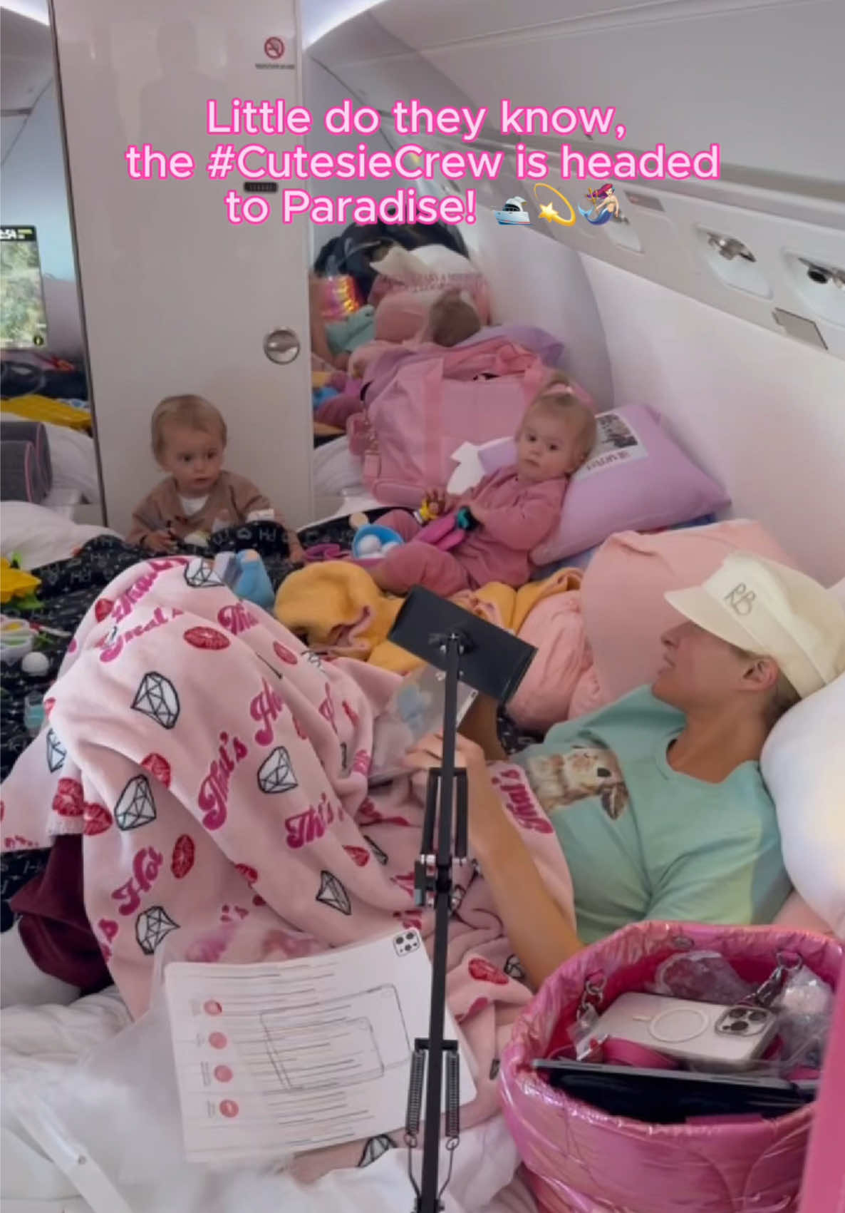 A post by @parishilton on TikTok caption: Next stop: paradise 💖🥹🌴 Sliving in the sky with my #CutesieCrew on #SlivAir! ✈️✨