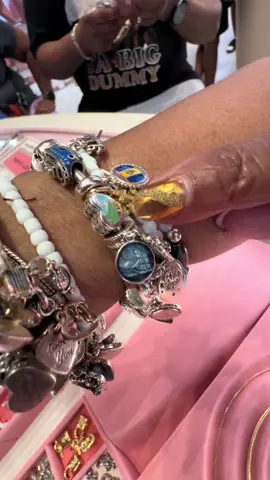 A post by @pandoralasvegas on TikTok caption: Love her travel bracelet thank you for coming to see me #pandoratravel #pandora #pandorajewelry #pandoralasvegas #fyp #foryou 